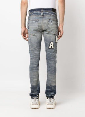 Varsity Ripped Skinny Jeans Amiri